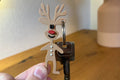 Llavero navideño de Rodolfo el Reno impreso en 3D, ideal como pequeño regalo de Navidad.