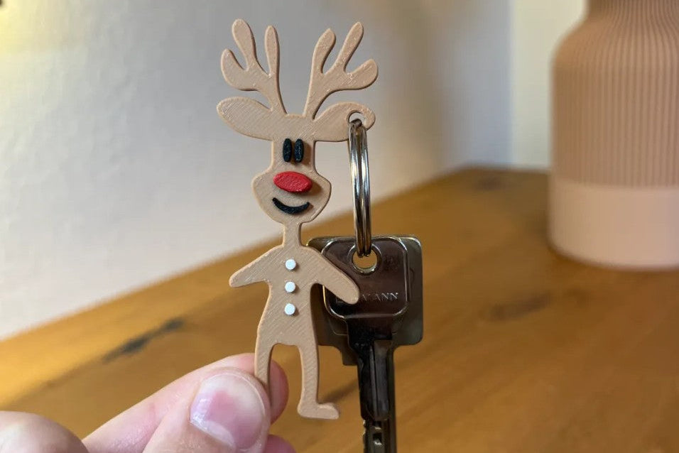 Llavero navideño de Rodolfo el Reno impreso en 3D, ideal como pequeño regalo de Navidad.